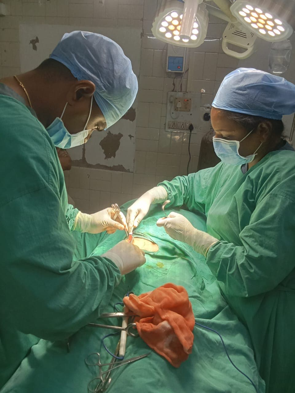 Our surgical team performing a procedure at Shivarth Hospital